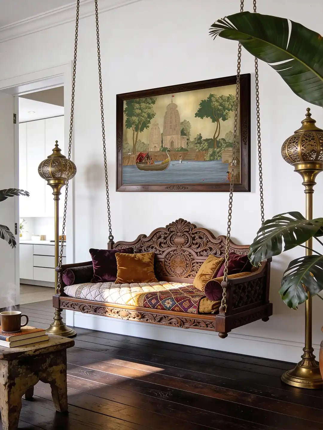 Kashi Reverie Wallart - Marble Lotus - A sophisticated living room featuring Kashi Reverie temple art styled above a carved wooden jhoola swing and ornate brass floor lamps.
