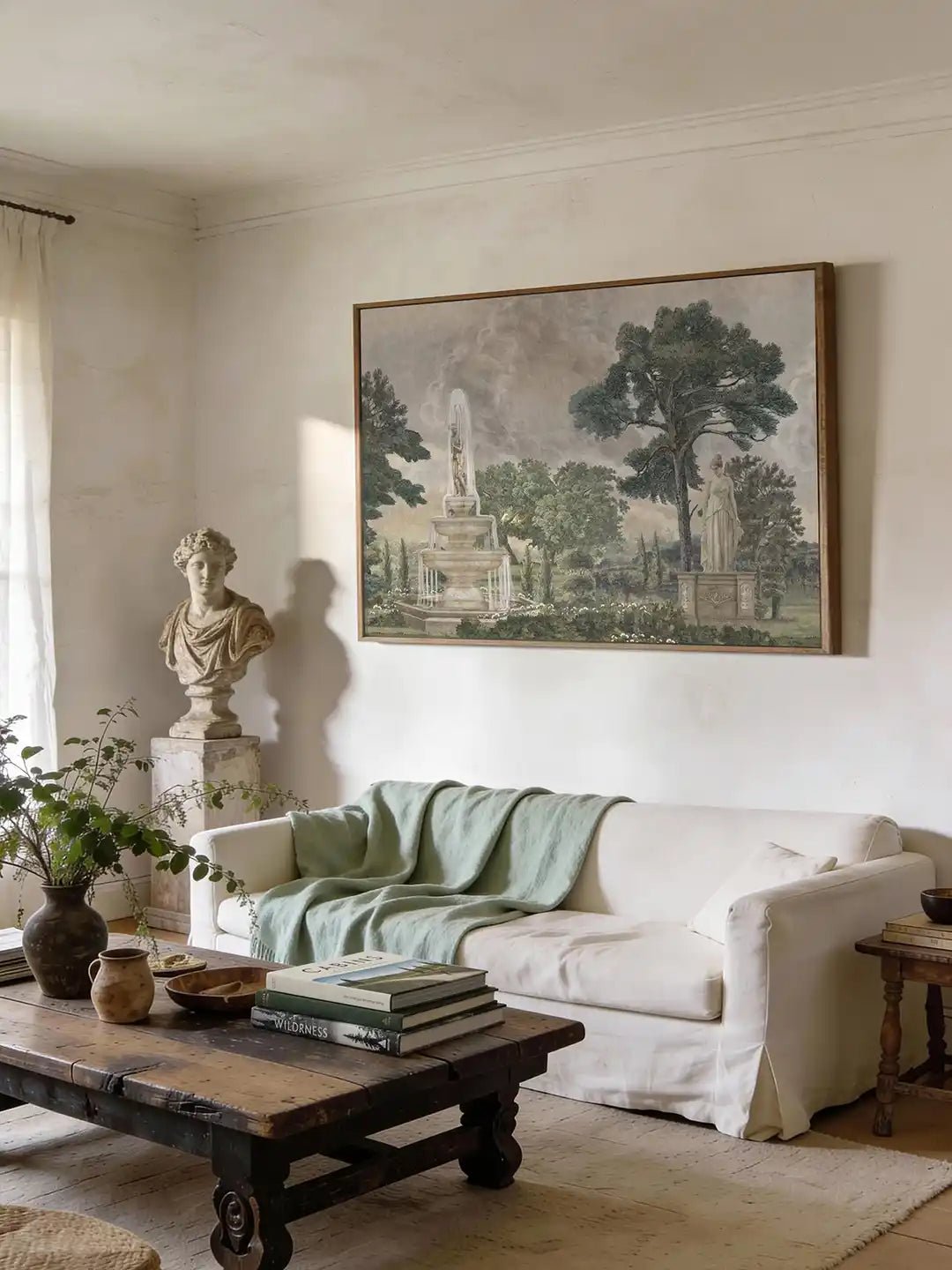 Vintage European Landscape Wallart - Marble Lotus - Framed vintage European landscape art mounted above a white linen sofa with a sage green throw in a sunlit living room.
